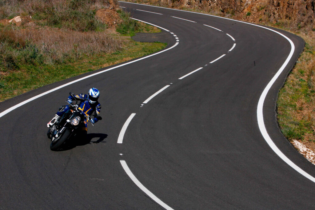 KTM motorcyclist riding on the road