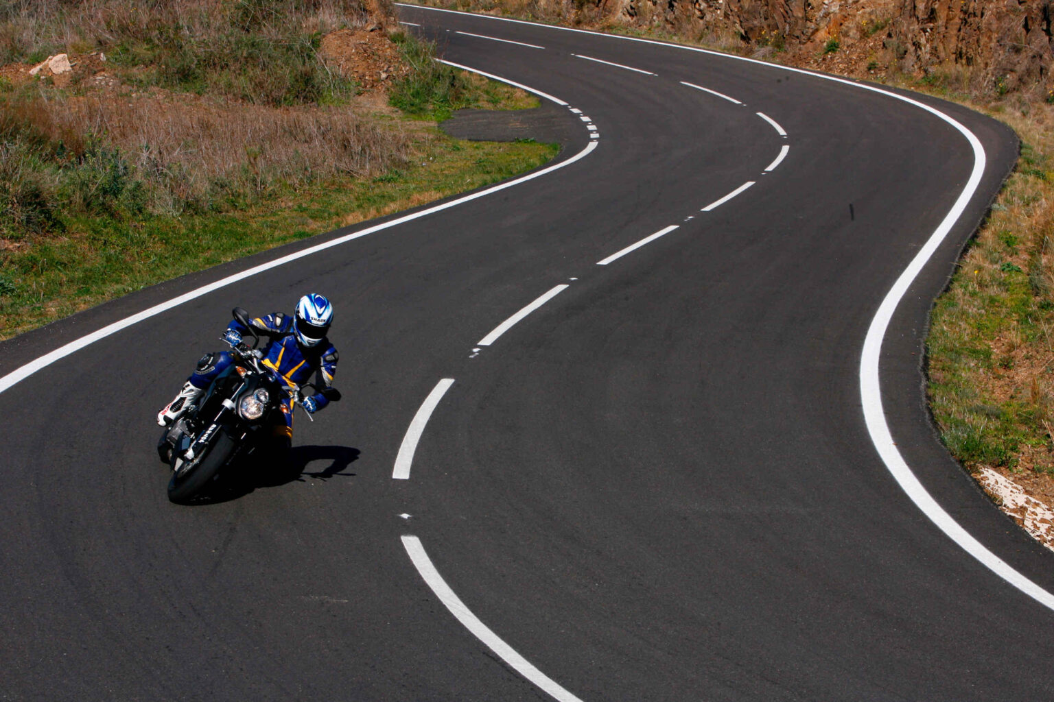 KTM motorcyclist riding on the road
